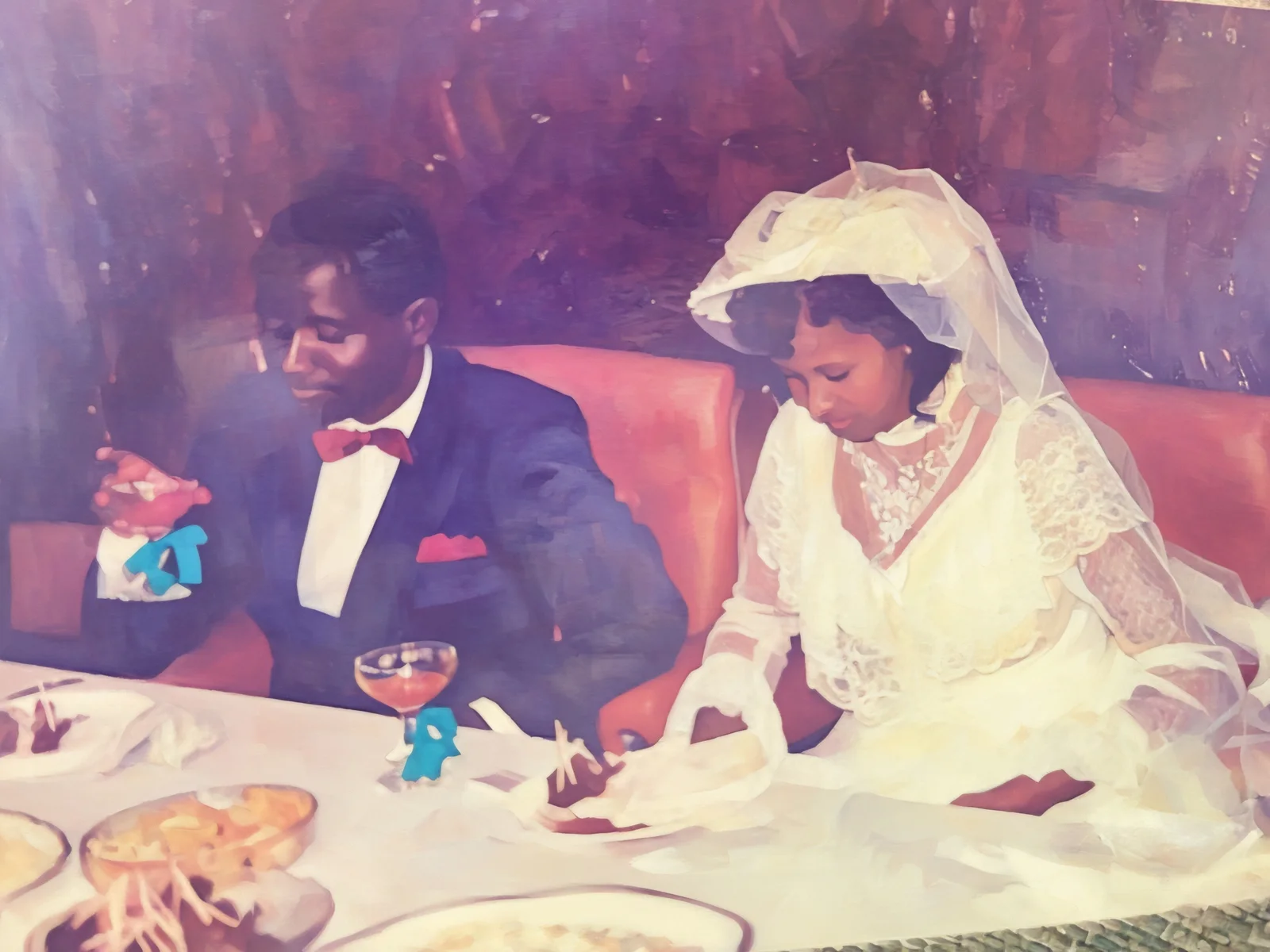A real family photograph: a bride and groom at their wedding table in Monrovia